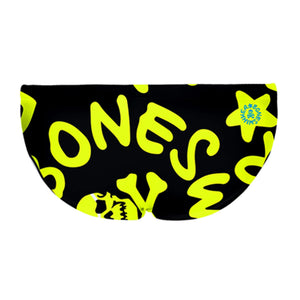 Costume taglio slip da bambino per allenamento nuoto in piscina Boneswimmer, modello H2OTTO 284HF con grafica teschi e simboli giallo fluo su sfondo nero, retro